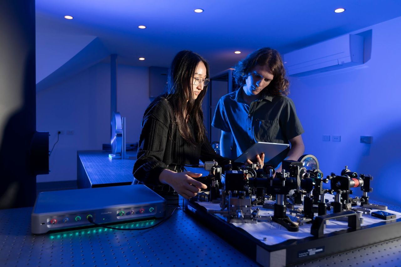 Engineers in a quantum optics laboratory.